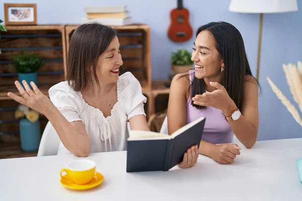 Two Women Mother Daughter Drinking Coffee Reading Book Home — Stock Photo, Image
