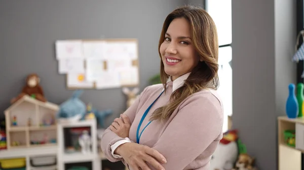 Young Beautiful Hispanic Woman Preschool Teacher Smiling Confident Standing Arms — Foto de Stock