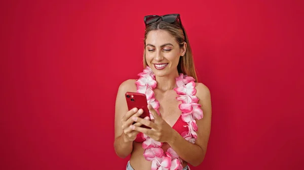 Young Blonde Woman Tourist Using Smartphone Smiling Isolated Red Background — Stock Photo, Image