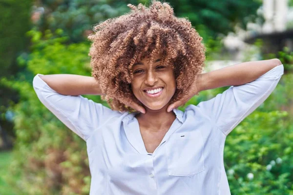 African American Woman Smiling Confident Relaxed Hands Head Park — Stok fotoğraf