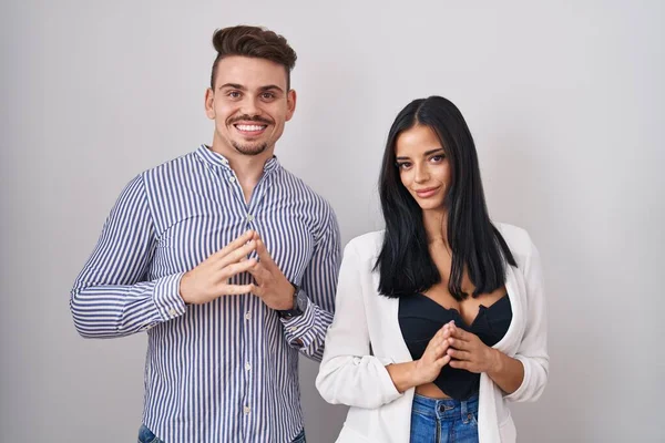 Young Hispanic Couple Standing White Background Hands Together Fingers Crossed — Stock Photo, Image