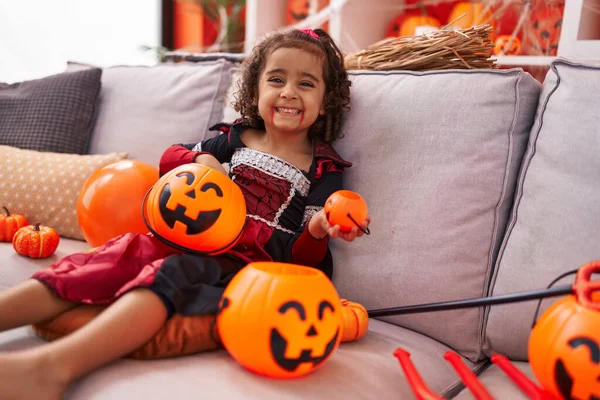Adorable Hispanic Girl Wearing Halloween Costume Holding Pumpkin Basket Home — Fotografia de Stock