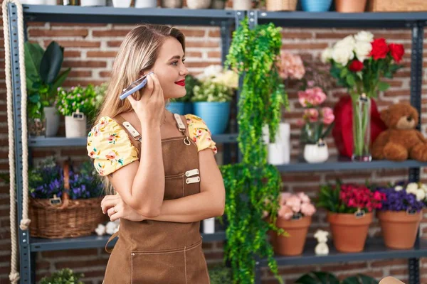 Young Beautiful Hispanic Woman Florist Smiling Confident Talking Smartphone Flower — Stockfoto