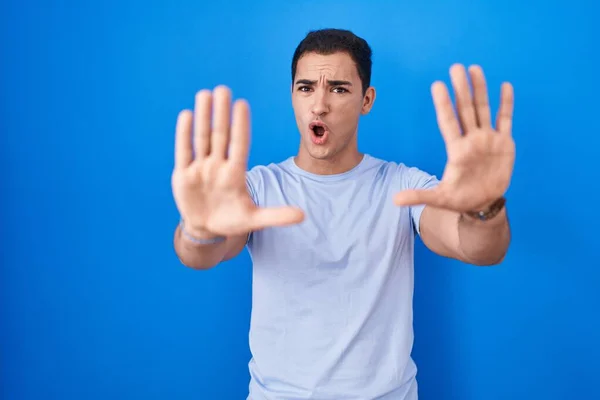 Young Hispanic Man Standing Blue Background Doing Stop Gesture Hands — Stock Photo, Image