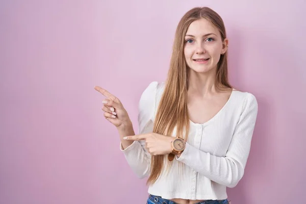 Young Caucasian Woman Standing Pink Background Pointing Aside Worried Nervous —  Fotos de Stock