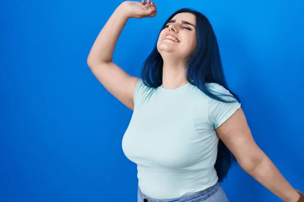 Young Modern Girl Blue Hair Standing Blue Background Dancing Happy — Stock Photo, Image