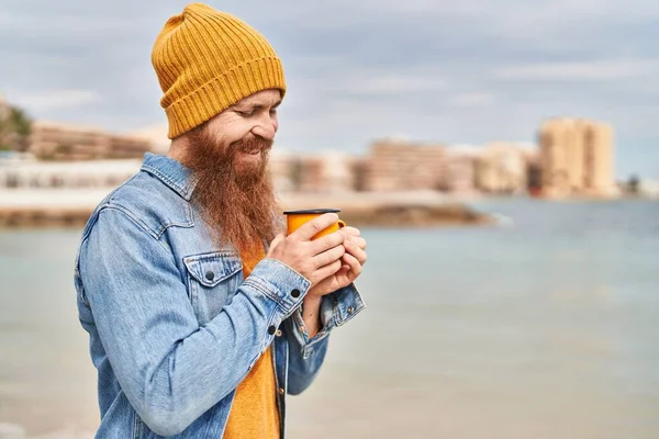 Young Redhead Man Smiling Confident Drinking Cup Coffee Seaside — Stock Photo, Image