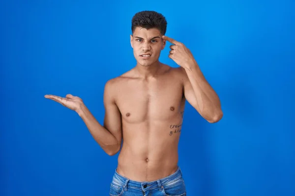 Young Hispanic Man Standing Shirtless Blue Background Confused Annoyed Open — Stock Photo, Image