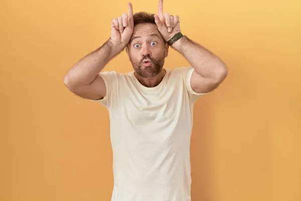 Middle Age Man Beard Standing Yellow Background Doing Funny Gesture — Stock Photo, Image