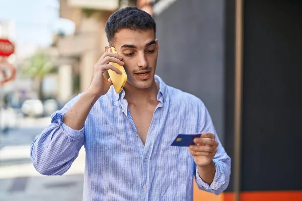 Young Hispanic Man Talking Smartphone Using Credit Card Street — Photo