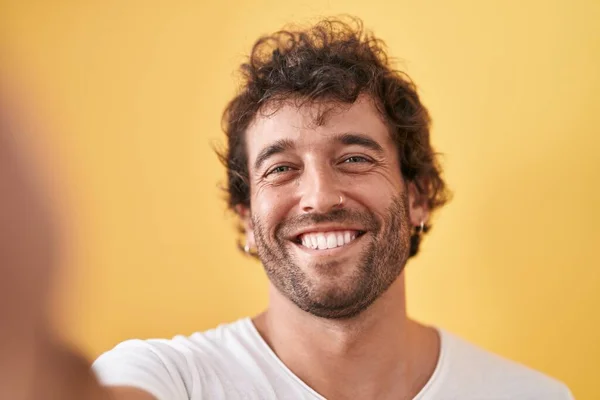 Young Hispanic Man Smiling Confident Making Selfie Camera Isolated Yellow — ストック写真