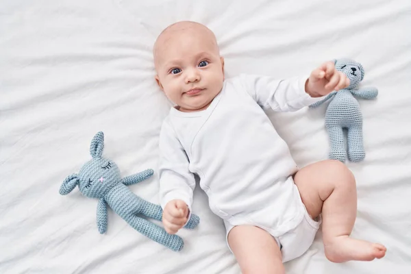 Adorable Caucasian Baby Lying Bed Dolls Bedroom — Stockfoto