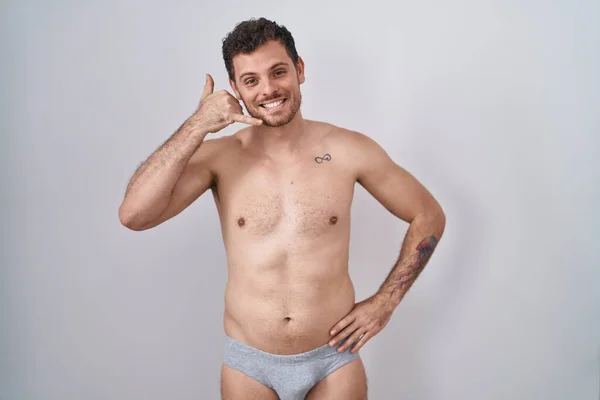 Young Hispanic Man Standing Shirtless Wearing Underware Smiling Doing Phone — Stock Photo, Image