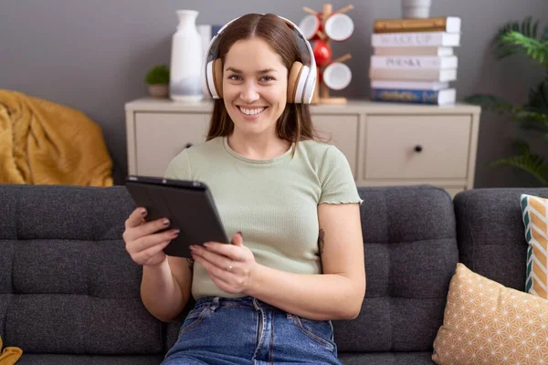 Young Beautiful Woman Watching Video Touchpad Sitting Sofa Home —  Fotos de Stock