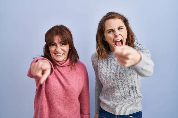 Mother Daughter Standing Blue Background Pointing Displeased Frustrated Camera Angry — ストック写真