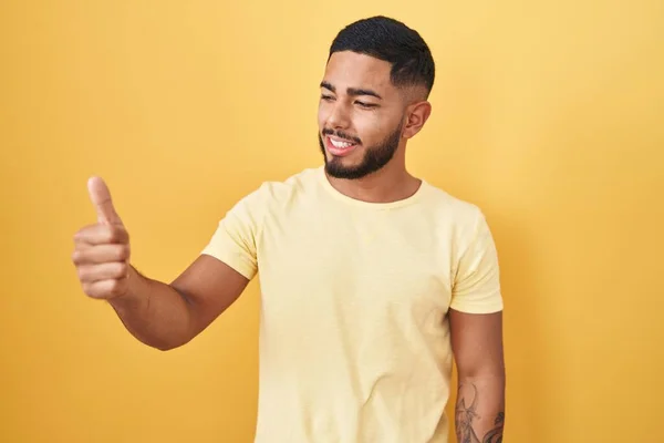 Young Hispanic Man Standing Yellow Background Looking Proud Smiling Doing — Stockfoto