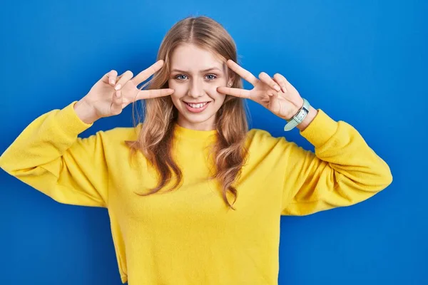 Young Caucasian Woman Standing Blue Background Doing Peace Symbol Fingers — 图库照片