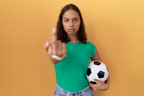 Young Hispanic Woman Holding Ball Showing Middle Finger Impolite Rude — Stok fotoğraf