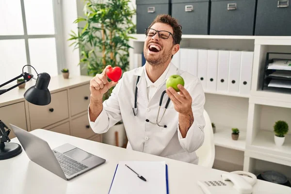 Young Hispanic Man Working Dietitian Clinic Smiling Laughing Hard Out — Stock Photo, Image
