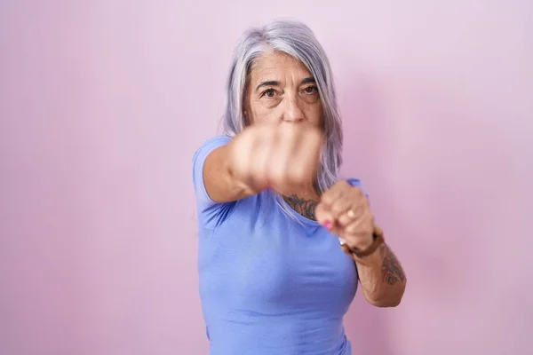 Middle Age Woman Tattoos Standing Pink Background Punching Fist Fight — Stock Photo, Image