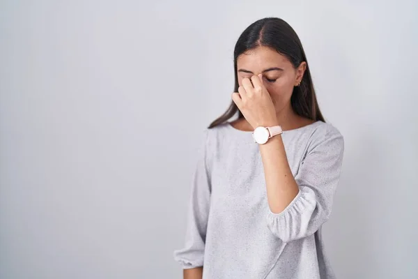 Young Hispanic Woman Standing White Background Tired Rubbing Nose Eyes — Fotografia de Stock