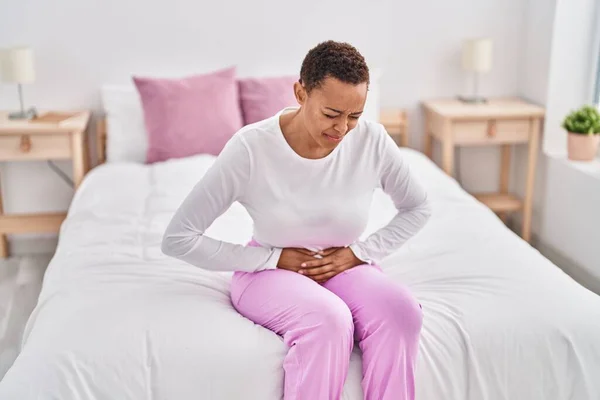 African American Woman Suffering Menstrual Pain Sitting Bed Bedroom — Stok fotoğraf