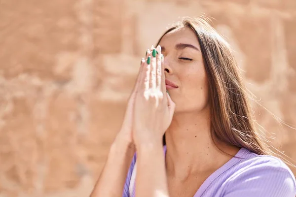 Young Beautiful Hispanic Woman Praying Closed Eyes Isolated Stone Background — Stock Fotó