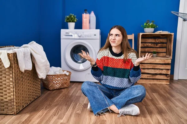 Young Hispanic Girl Doing Laundry Clueless Confused Expression Arms Hands — Stock Photo, Image