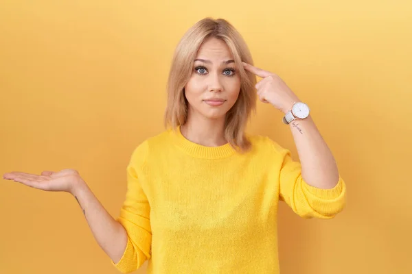 Young Caucasian Woman Wearing Yellow Sweater Confused Annoyed Open Palm — Stock Photo, Image