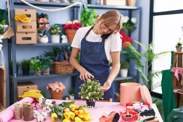 Young Blonde Girl Florist Talking Smartphone Cutting Plant Florist — Stock Photo, Image