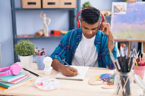 Young Latin Man Artist Listening Music Drawing Notebook Art Studio — Foto de Stock