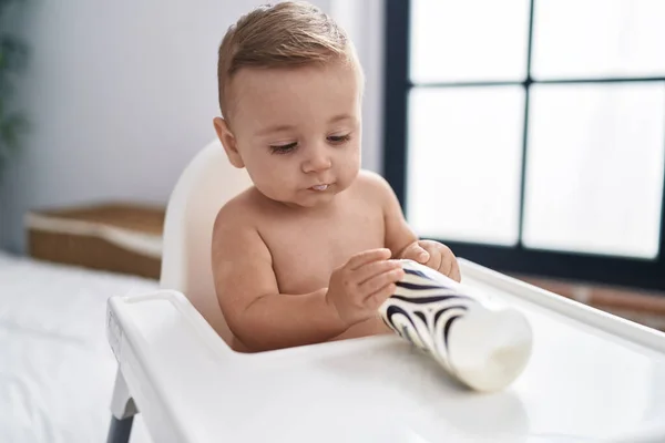 Adorable Caucasian Baby Holding Feeding Bottle Sitting Highchair Home — Stock Photo, Image