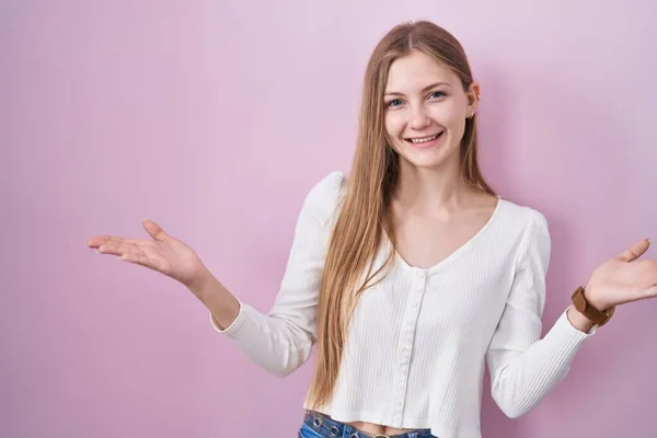 Young Caucasian Woman Standing Pink Background Smiling Cheerful Offering Hands —  Fotos de Stock