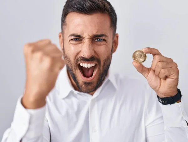 Handsome Hispanic Man Holding Polkadot Cryptocurrency Coin Annoyed Frustrated Shouting — Stock Photo, Image