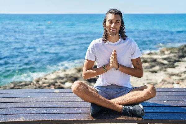 Young Hispanic Man Doing Yoga Exercise Sitting Bench Seaside — Φωτογραφία Αρχείου