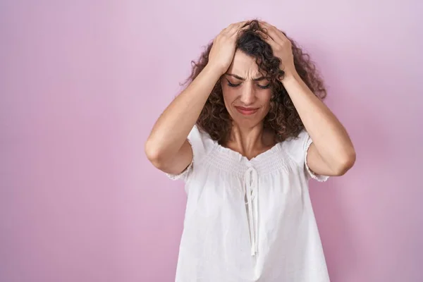 Hispanic Woman Curly Hair Standing Pink Background Suffering Headache Desperate — Stock Fotó