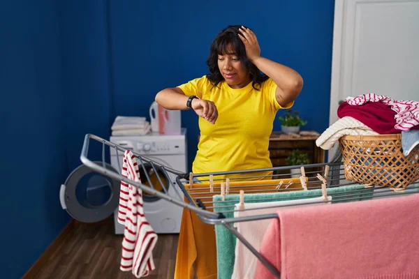 Young Beautiful Latin Woman Looking Clock Hanging Clothes Clothesline Laundry — Stock fotografie