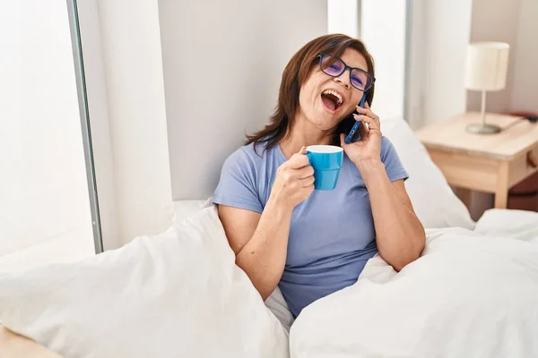 Middle Age Woman Talking Smartphone Drinking Coffee Bedroom — Stock fotografie