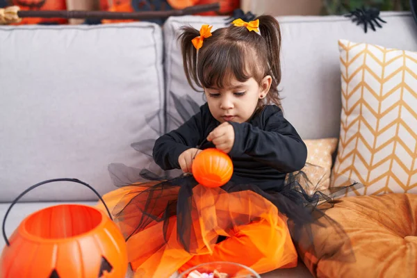Adorable Hispanic Girl Wearing Halloween Costume Holding Pumpkin Basket Home — Foto de Stock