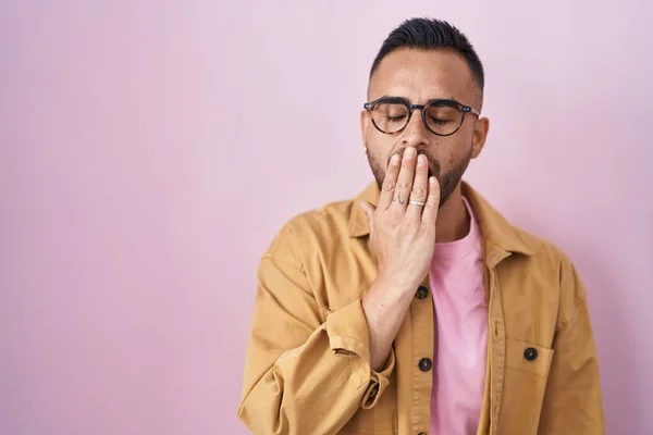 Young Hispanic Man Standing Pink Background Bored Yawning Tired Covering — Zdjęcie stockowe