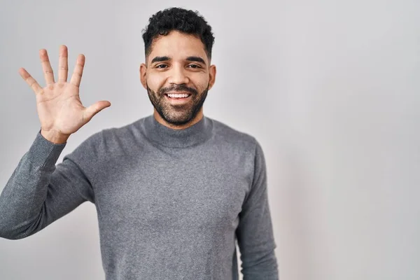 Hispanic Man Beard Standing White Background Showing Pointing Fingers Number — Stock Fotó