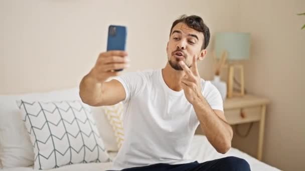 Young Hispanic Man Having Video Call Sitting Bed Bedroom — Stok Video