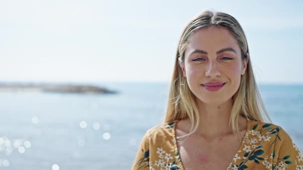 Young Blonde Woman Smiling Confident Standing Seaside — Video Stock
