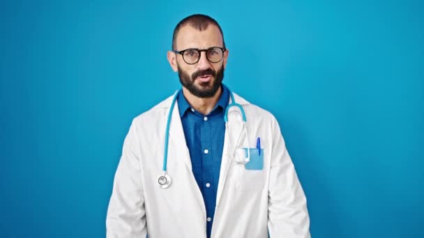 Young Hispanic Man Doctor Doing Calm Gesture Hands Isolated Blue — Stock Video