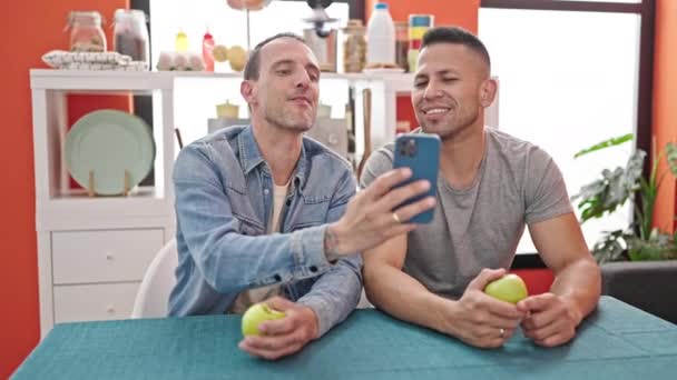 Two Men Couple Make Selfie Smartphone Holding Apple Dinning Room — Stock Video