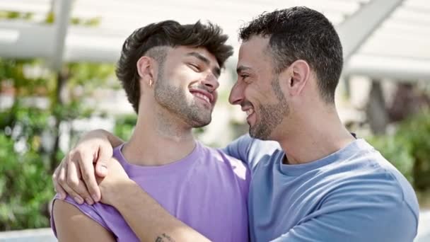 Two Men Couple Smiling Confident Hugging Each Other Park — Vídeo de Stock