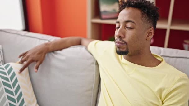 African American Man Smiling Confident Sitting Sofa Home — Vídeos de Stock