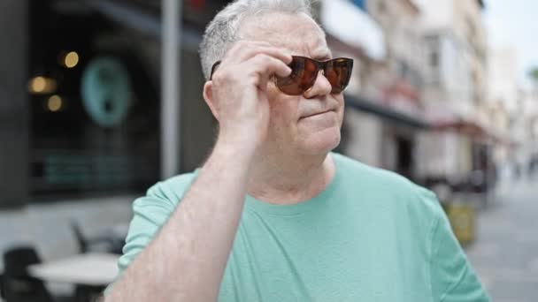 Middle Age Grey Haired Man Smiling Confident Taking Out Sunglasses — Stock Video
