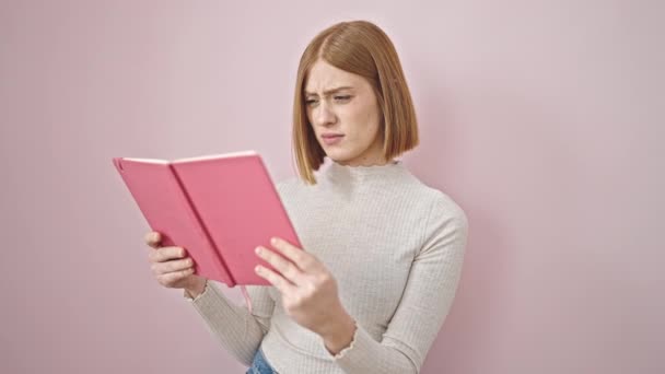 Young Blonde Woman Reading Book Looking Upset Isolated Pink Background — Stock Video