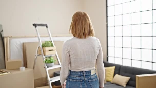 Young Blonde Woman Standing Backwards Looking New Home — Stock Video